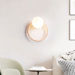 Orria Travertine Wall Sconce with Opaline Glass Globe