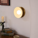 Solar Eclipse Brass Wall Sconce with Glass Shade for Modern Interiors