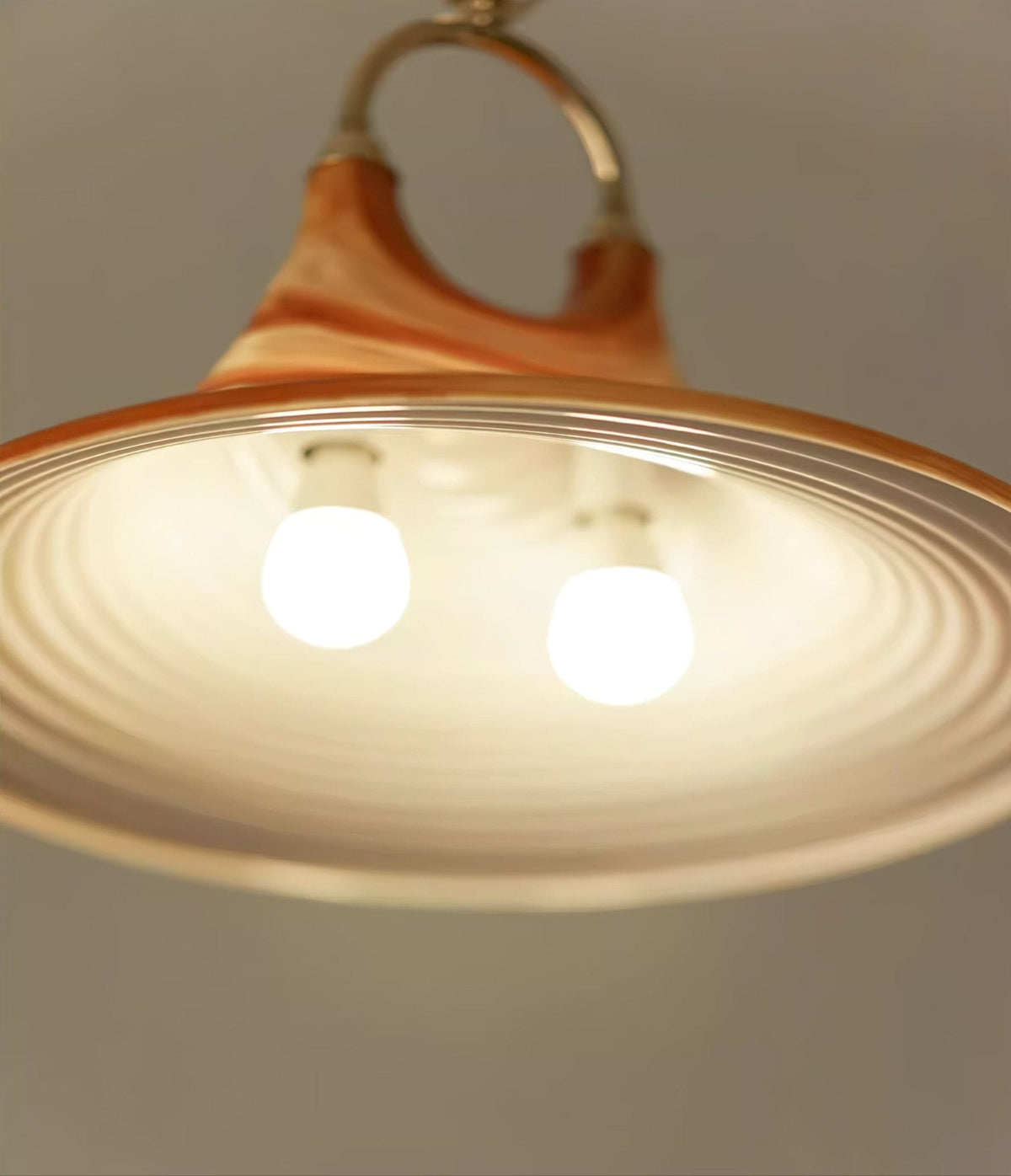 Solari Swirl Glass Pendant Light – Hand-Blown Amber Art Glass
