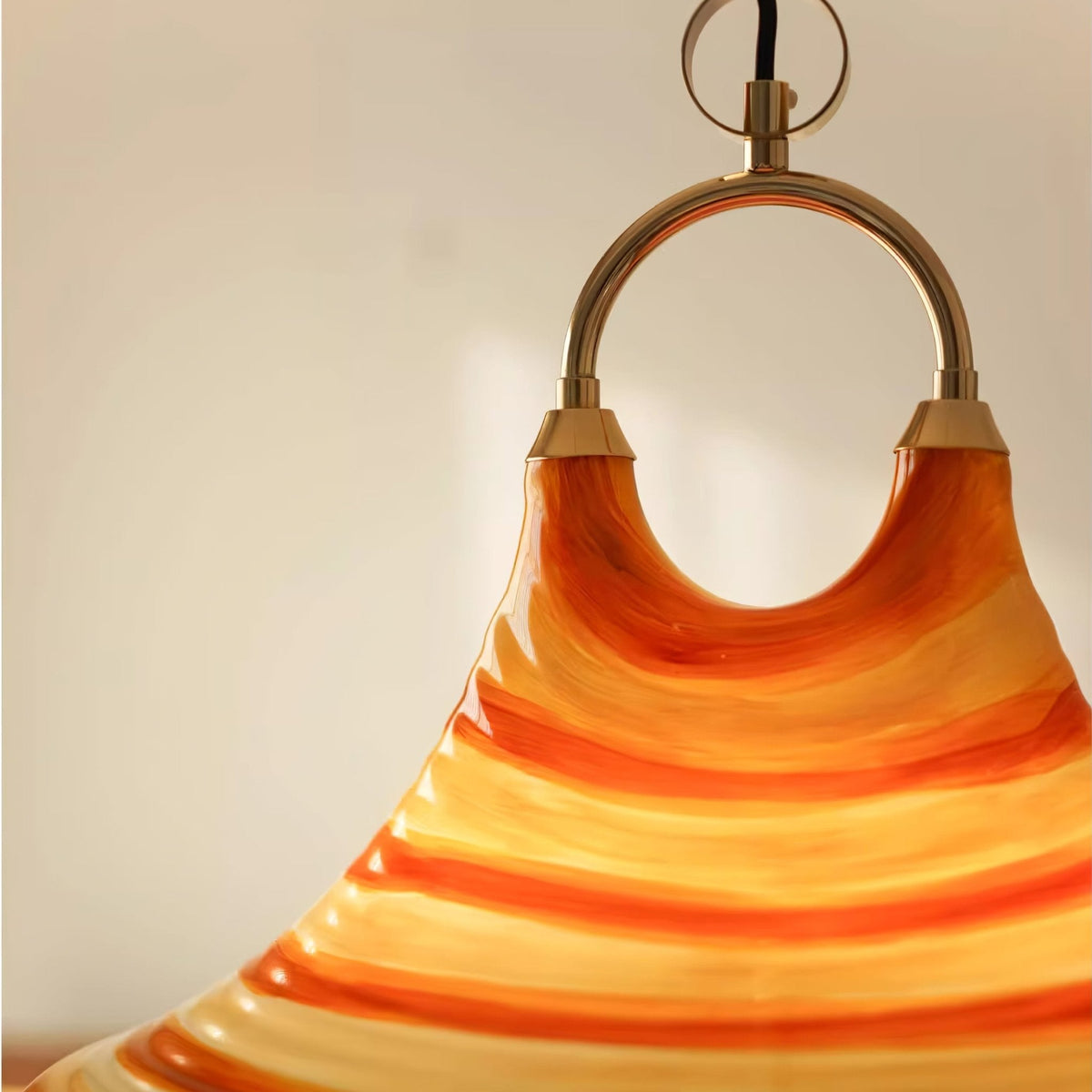 Solari Swirl Glass Pendant Light – Hand-Blown Amber Art Glass
