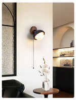 Solstice Pivot Wall Sconce in Black Travertine and Walnut