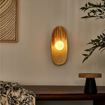 Solstice Swirl Ceramic Wall Sconce with Glowing Orb