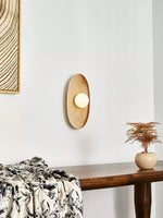 Solstice Swirl Ceramic Wall Sconce with Glowing Orb
