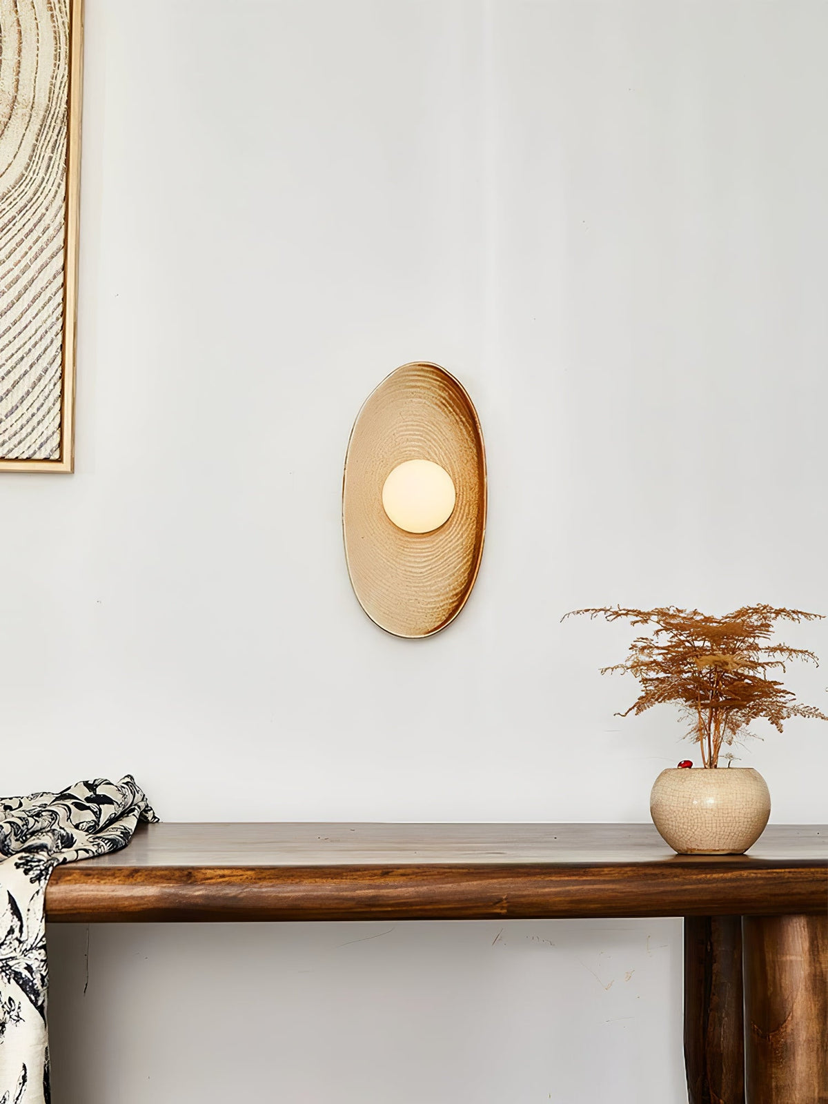 Solstice Swirl Ceramic Wall Sconce with Glowing Orb