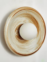 Solstice Swirl Ceramic Wall Sconce with Glowing Orb