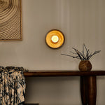 Solstice Swirl Ceramic Wall Sconce with Glowing Orb