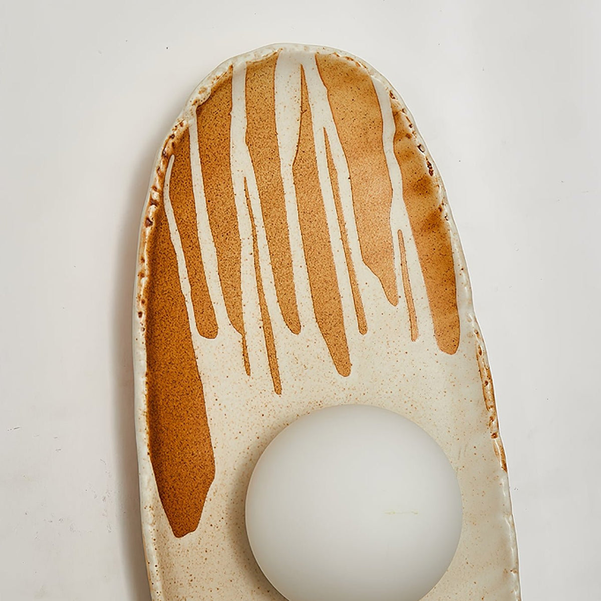 Solstice Swirl Ceramic Wall Sconce with Glowing Orb