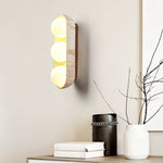 Solstice Trio Wall Sconce in Travertine and Wood – Modern Ambient Lighting