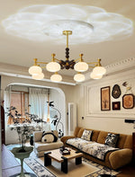 Solviento Modern Brass and Wood Chandelier with Glass Globes