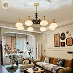Solviento Modern Brass and Wood Chandelier with Glass Globes