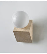 Tavian Orb Travertine Wall Sconce with Glass Globe