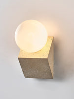 Tavian Orb Travertine Wall Sconce with Glass Globe