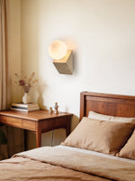 Tavian Orb Travertine Wall Sconce with Glass Globe