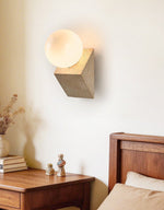 Tavian Orb Travertine Wall Sconce with Glass Globe