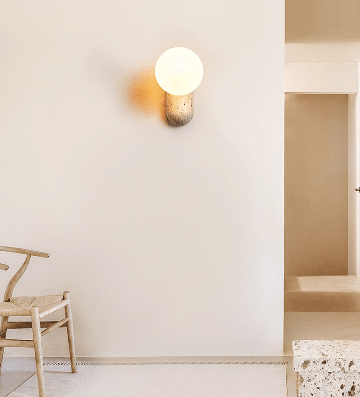 Travertine Pebble Wall Sconce with Opal Glass Globe for Modern Interiors