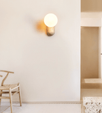 Travertine Pebble Wall Sconce with Opal Glass Globe for Modern Interiors
