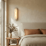 Travertine Pill Wall Sconce with Alabaster Glow and Aged Brass Accents