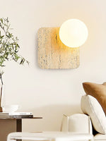 Travora Globe Wall Sconce in Natural Travertine with Opal Glass Shade