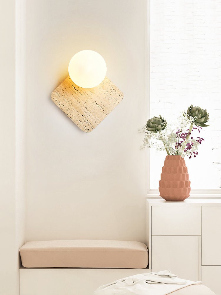 Travora Globe Wall Sconce in Natural Travertine with Opal Glass Shade