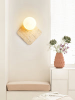 Travora Globe Wall Sconce in Natural Travertine with Opal Glass Shade
