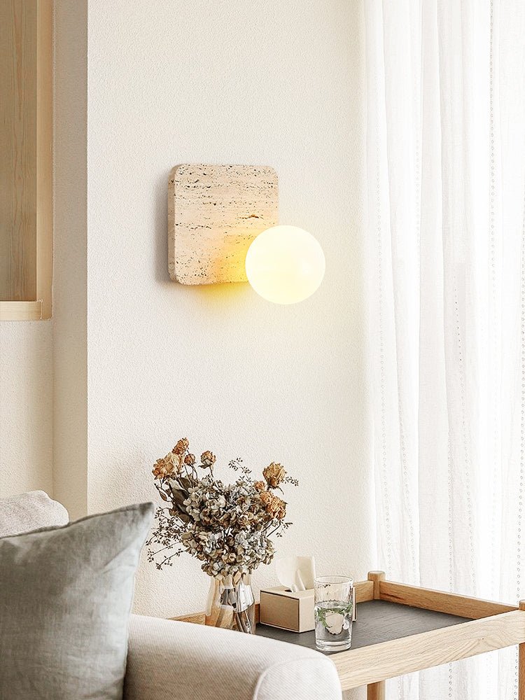 Travora Globe Wall Sconce in Natural Travertine with Opal Glass Shade