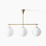 Trilo Globe Pendant Light – Three Opal Glass Spheres on a Sleek Bar