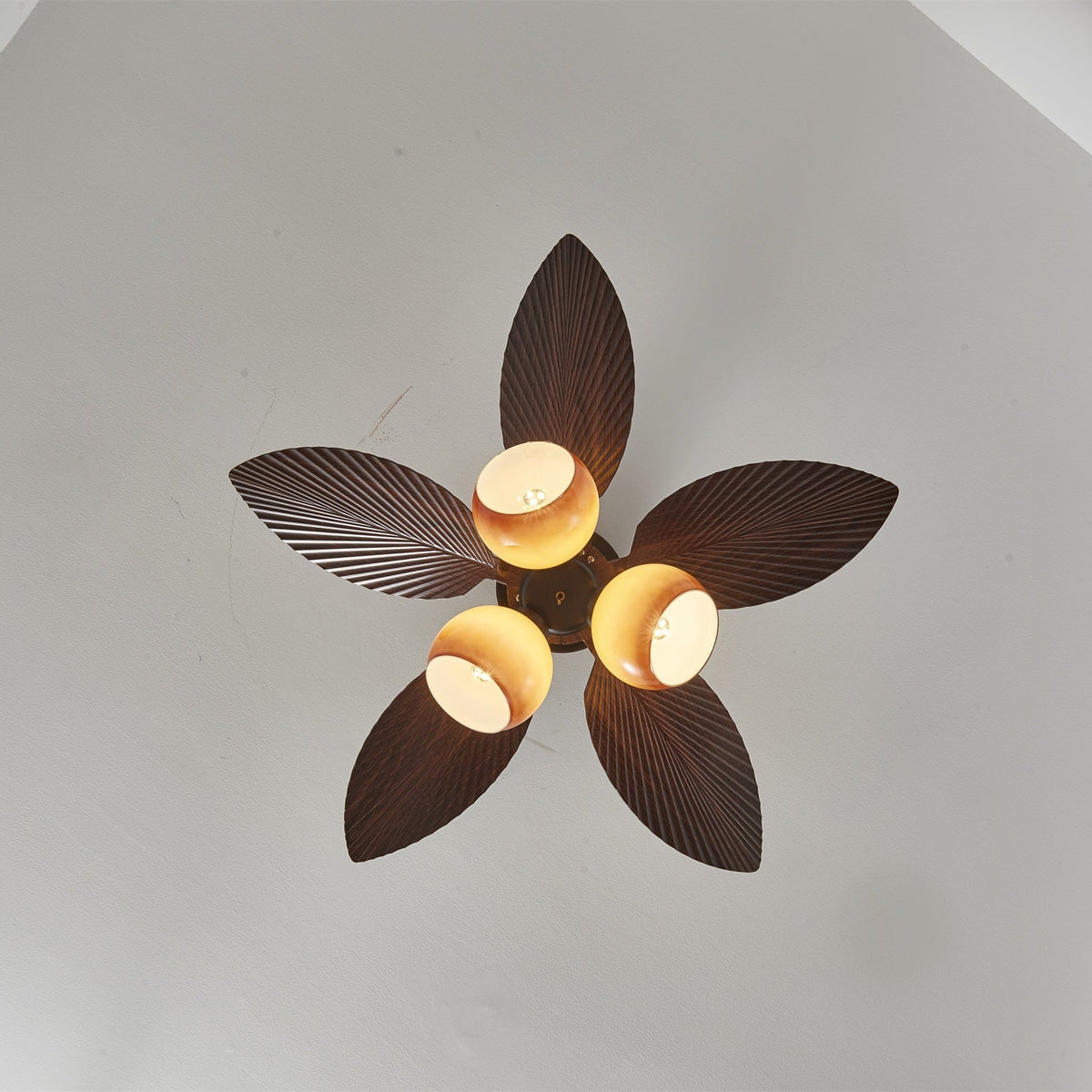 Tropiluxe Ceiling Fan Light with Palm Leaf Blades and Amber Glass Shade