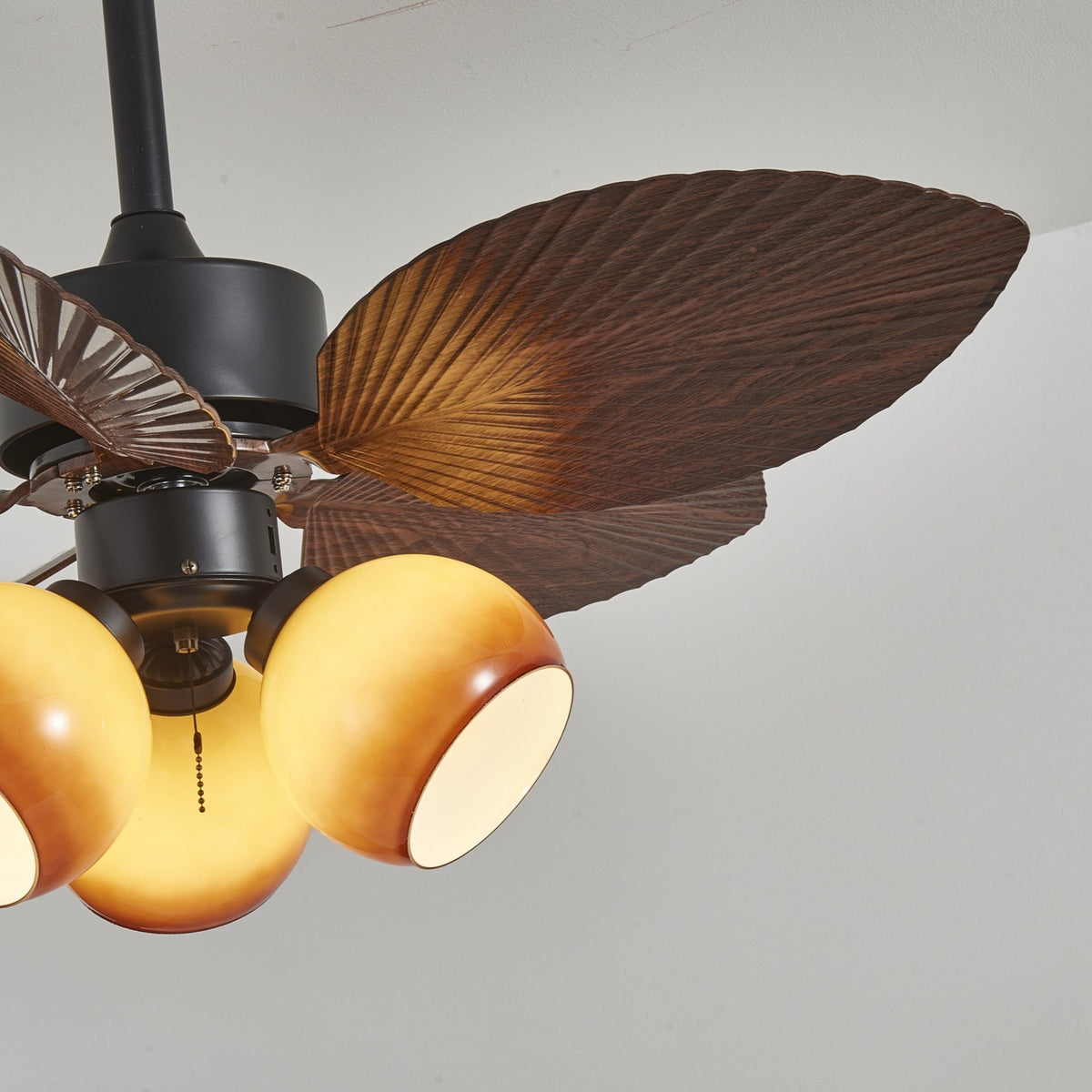 Tropiluxe Ceiling Fan Light with Palm Leaf Blades and Amber Glass Shade