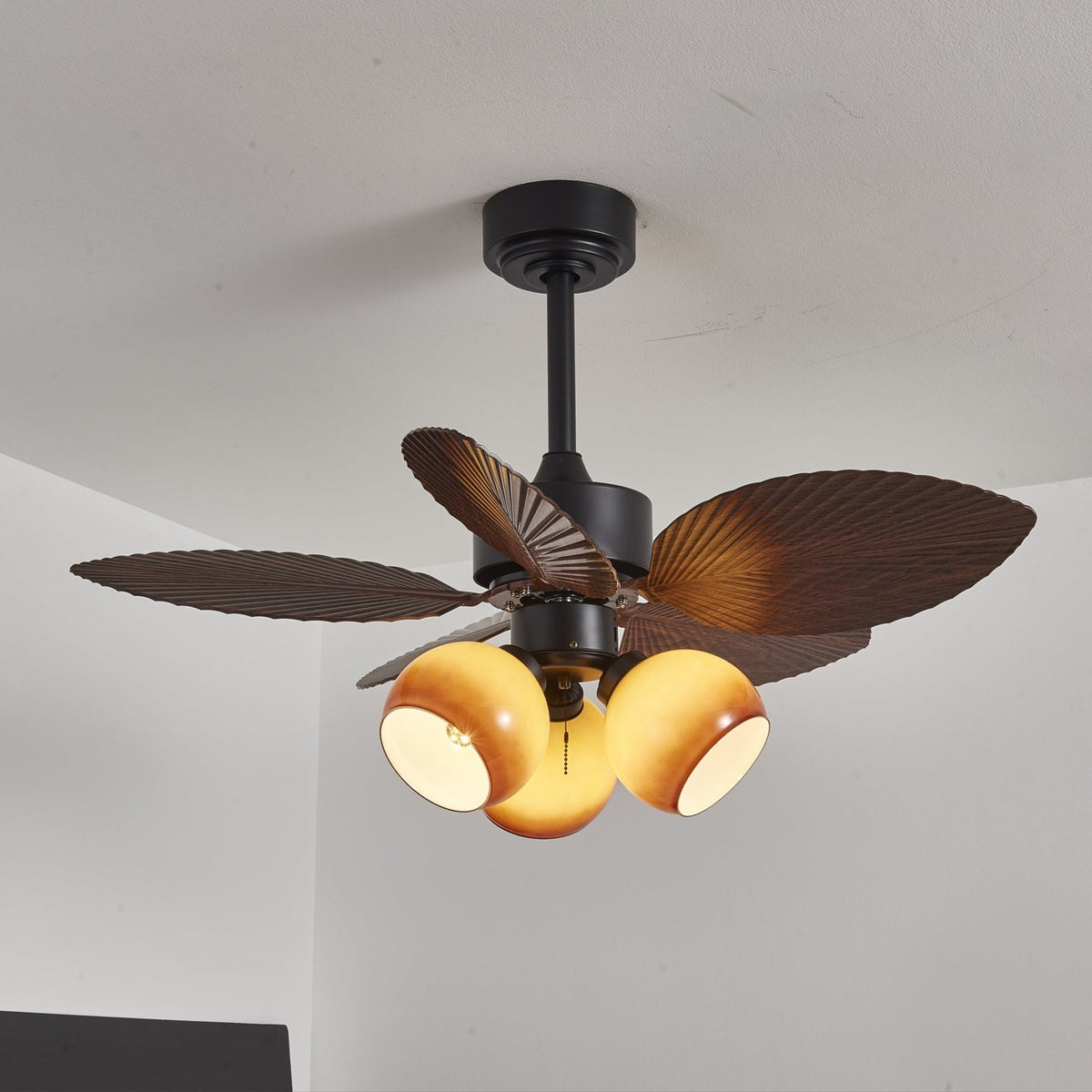 Tropiluxe Ceiling Fan Light with Palm Leaf Blades and Amber Glass Shade