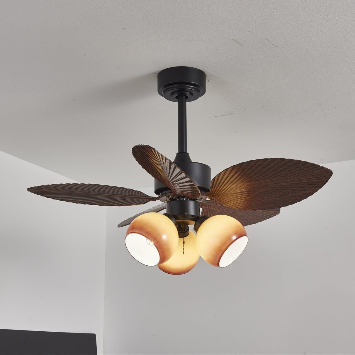 Tropiluxe Ceiling Fan Light with Palm Leaf Blades and Amber Glass Shade