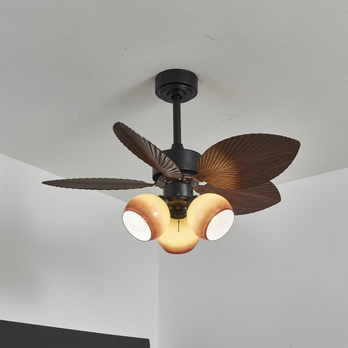 Tropiluxe Ceiling Fan Light with Palm Leaf Blades and Amber Glass Shade