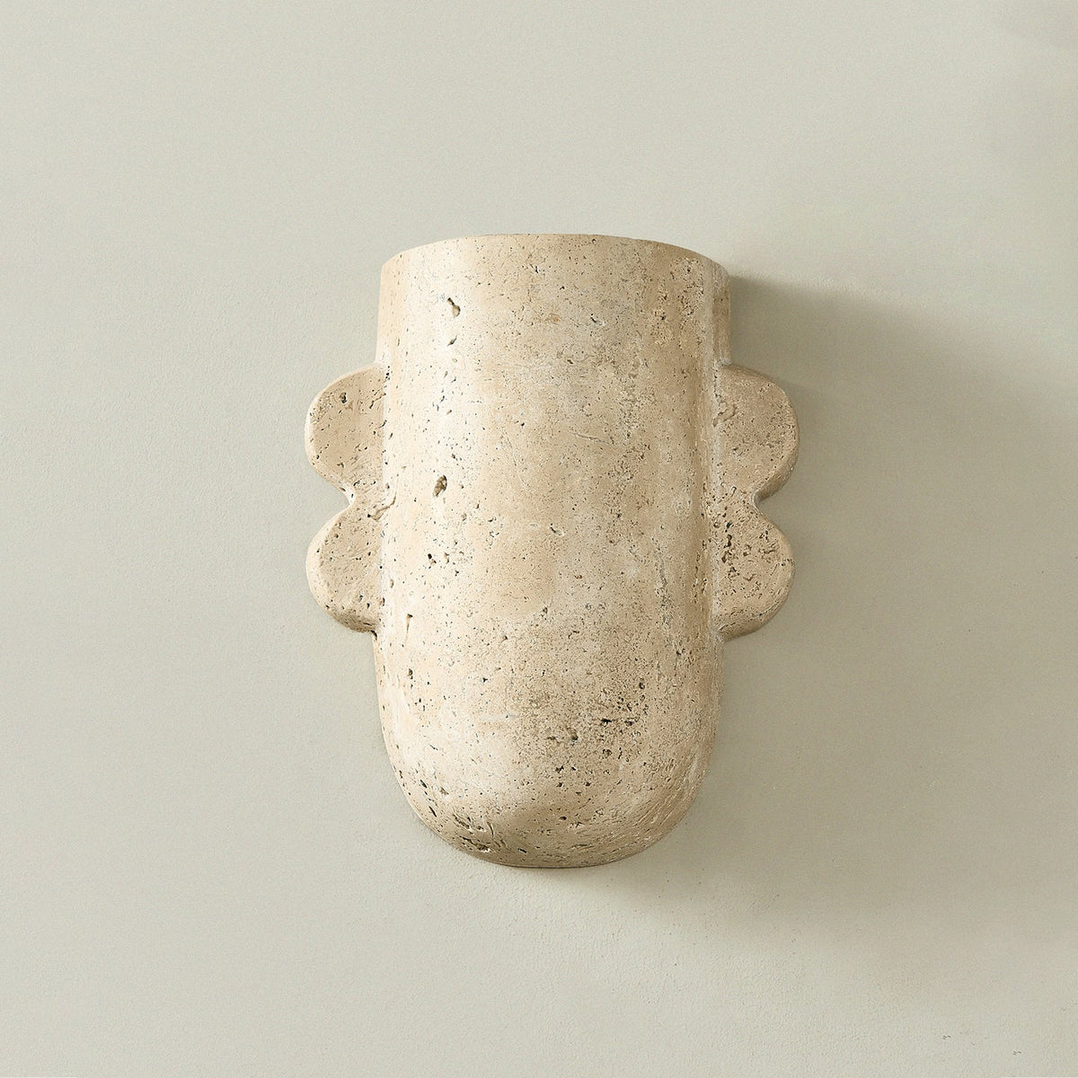Vaelis Sculptural Travertine Wall Sconce for Modern Interiors