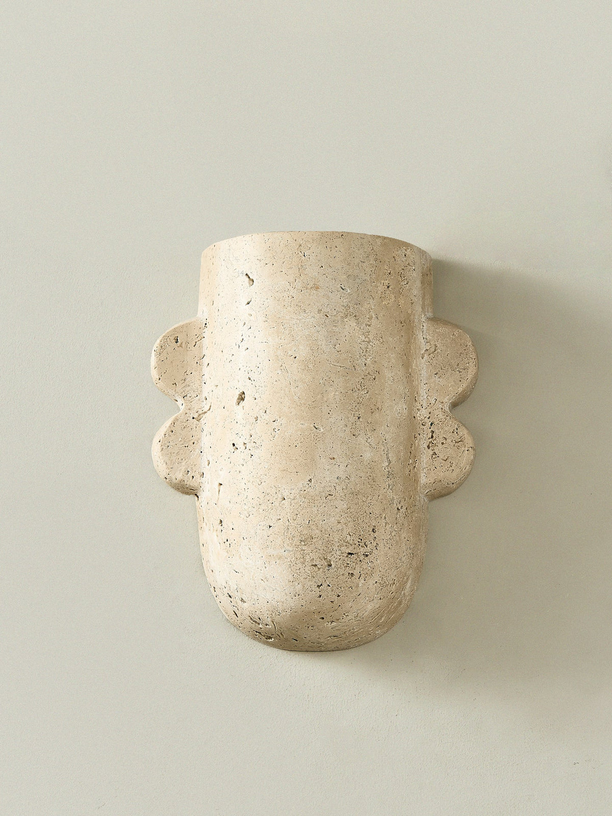 Vaelis Sculptural Travertine Wall Sconce for Modern Interiors