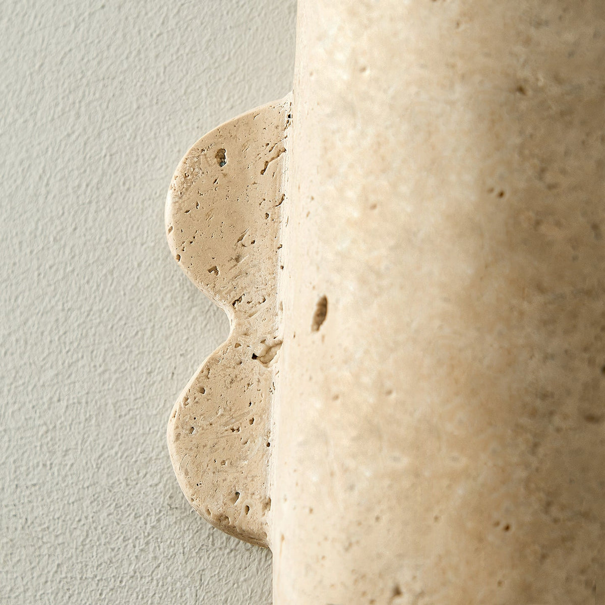 Vaelis Sculptural Travertine Wall Sconce for Modern Interiors