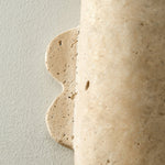 Vaelis Sculptural Travertine Wall Sconce for Modern Interiors