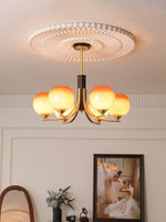 Caramel Globe Chandelier – Six-Light Brass & Glass Pendant for Dining and Living Spaces