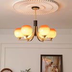 Caramel Globe Chandelier – Six-Light Brass & Glass Pendant for Dining and Living Spaces