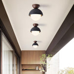 Volcanic Orb Flush Mount Ceiling Light in Black Travertine and Opal Glass