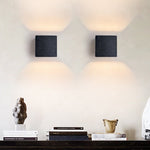Vulcanis Cube Wall Sconce in Black Travertine with Golden Interior