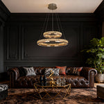 Gold Crystal Chandelier with Brass Wall Sconces and Recessed LED Lights