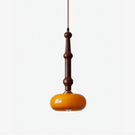 Solvra Modern Wood and Amber Glass Pendant Light for Dining Room