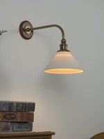 Ardent Swing Arm Wall Sconce in Brass and Glass for Modern Interiors