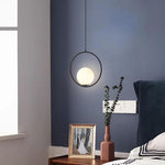 Aurelia Glass Globe Pendant Light in Matte Black Metal Ring