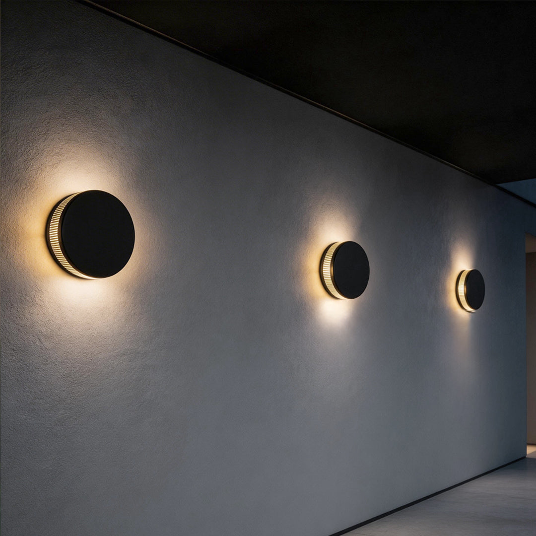 Modern Round Outdoor Wall Sconce in Black Stainless Steel with Warm LED Glow