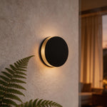 Modern Round Outdoor Wall Sconce in Black Stainless Steel with Warm LED Glow