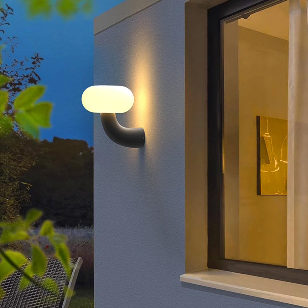 Arc Outdoor Wall Sconce in Black Stainless Steel with Warm LED Glow