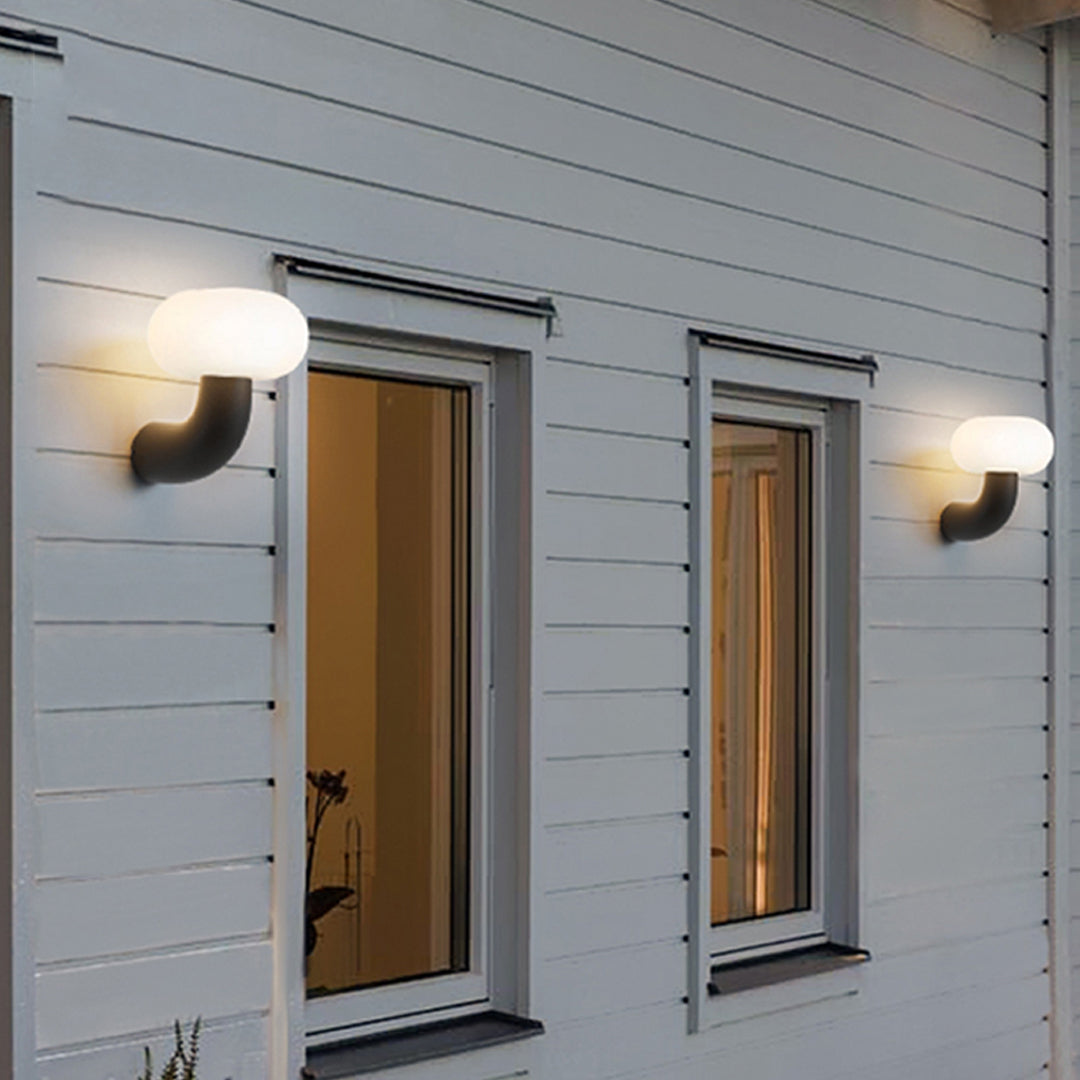 Arc Outdoor Wall Sconce in Black Stainless Steel with Warm LED Glow