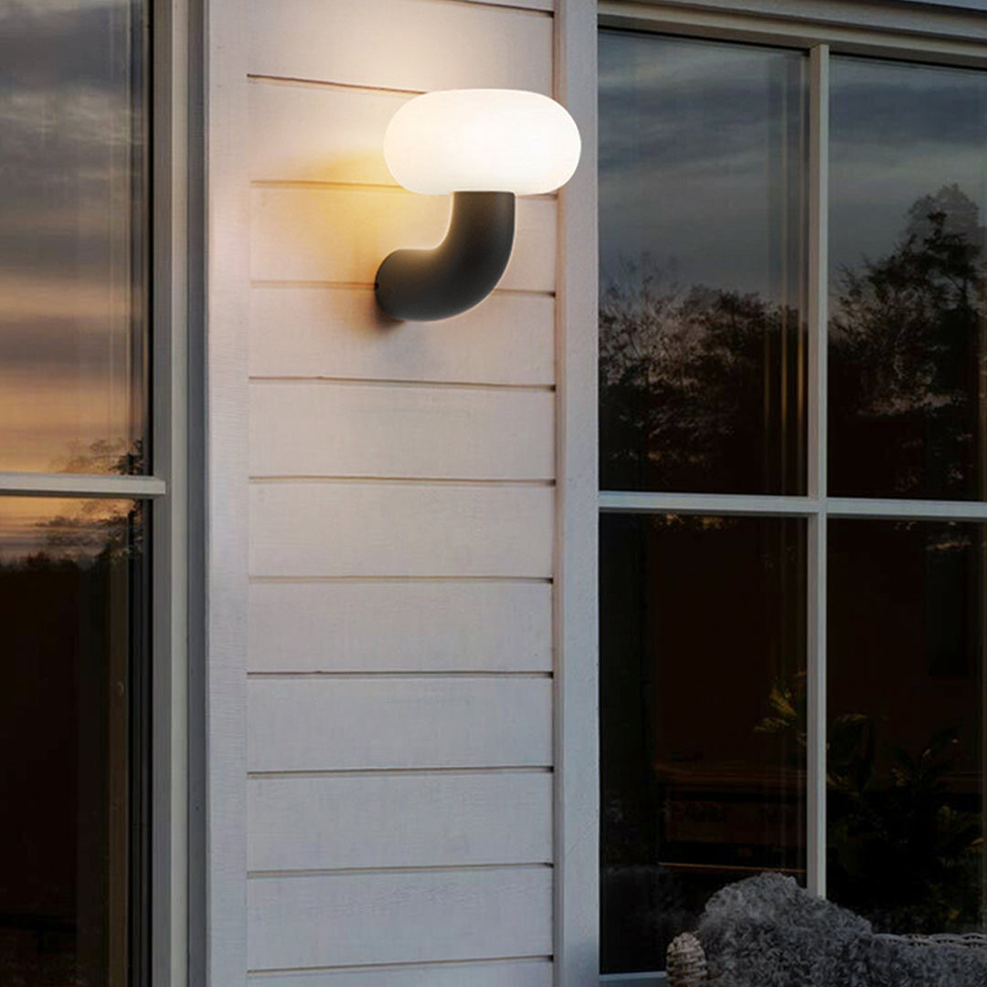 Arc Outdoor Wall Sconce in Black Stainless Steel with Warm LED Glow