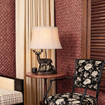 Sculpted Deer Table Lamp with Bronze Finish and Beige Linen Shade