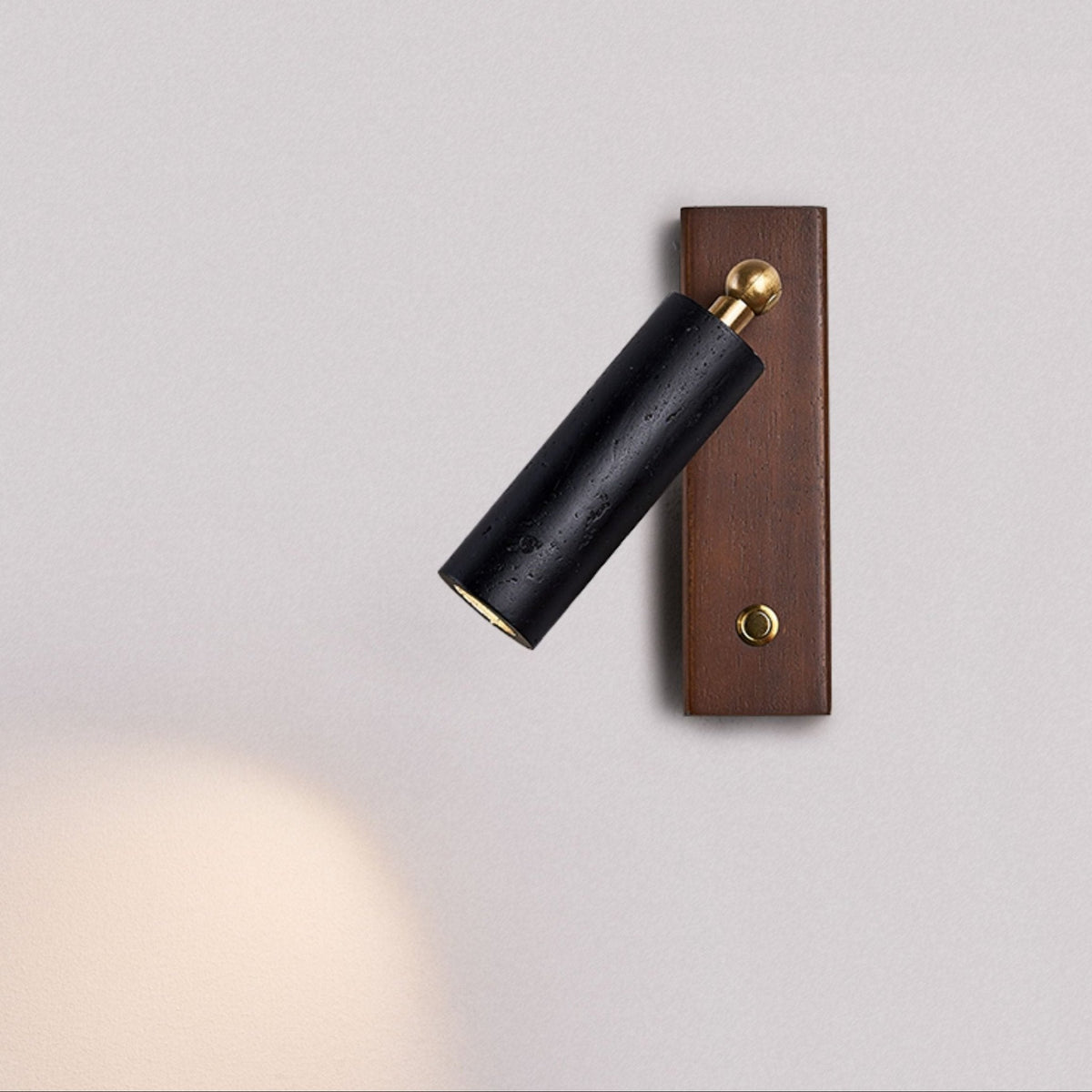 Event Horizon Adjustable Wall Sconce in Black Travertine and Brass